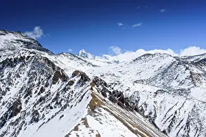 Himalaya Prints: Snowy Ridge Trail Leading South Toward Ganja La Pass with Far Distant View of the Rolwaling Himalaya from Kyanjin Ri