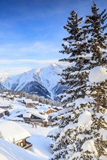 Cabin Prints: Snowy woods and mountain huts framed by the winter sunset, Bettmeralp, district of Raron