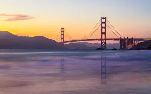 Strait Prints: Soft flowing water reflects the beautiful Golden Gate Bridge at sunset, San Francisco