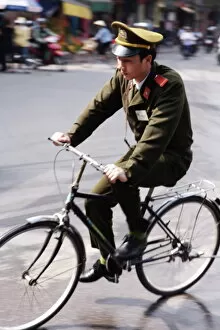 Soldier on bicycle, Hanoi, Vietnam, Indochina, Southeast Asia, Asia