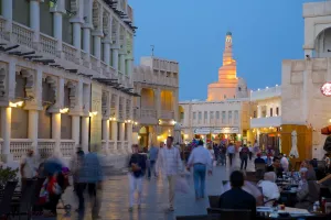 Qatar Prints: Souq Waqif looking towards the illuminated spiral mosque of the Kassem Darwish Fakhroo Islamic Centre