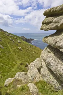 Foot Paths Prints: Part of the South West Coast Path at Mayon cliff near Lands End showing the Longships lighthouse in the distance