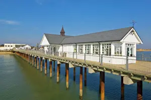 Suffolk Prints: Southwold pier looking back towards the shore in the early afternoon sunshine