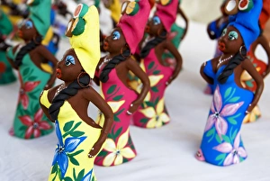 Images Dated 28th May 2009: Souvenir traditional Cuban lady statues for sale in craft market in Trinidad