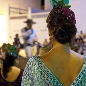 Wearing Prints: Spanish girl watching horse-back feria procession, Tarifa, Andalucia, Spain, Europe