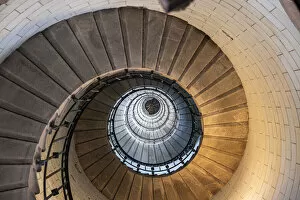 Direction Gallery: Spiral staircase from below in the Eckmuhl Lighthouse in Brittany, France, Europe