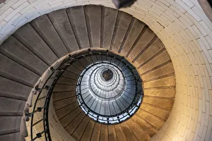 Direction Gallery: Spiral staircase from below in the Eckmuhl Lighthouse in Brittany, France, Europe