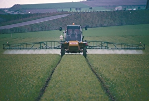 Approaching Prints: Spraying pesticides on crops in fields, Cambridgeshire, England, United Kingdom, Europe