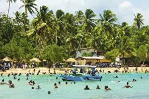 Galle Prints: Sri Lankans swimming at the west end of this popular resort and beach