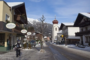 St. Anton am Arlberg main road and church in winter snow, Tyrol, Austrian Alps