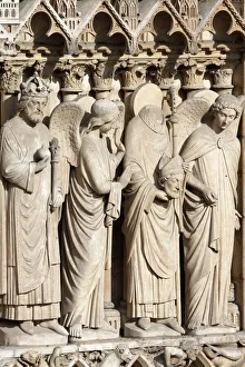 Cathedrals Prints: Detail of St. Denis holding his head flanked by two angels, Virgin portal, Western facade
