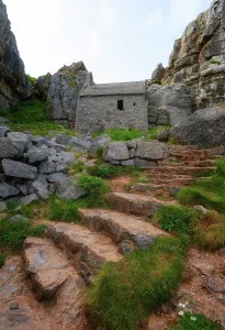 Chapel Prints: St Govans Chapel built into limestone cliff close to steep steps in Pembrokeshire, Wales