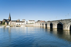 St. Maartenskerk (St. Martin Church) and St. Servatius Bridge on the River Ms