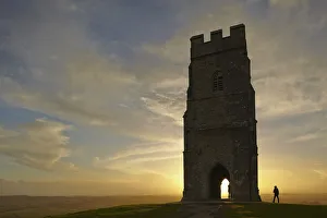 Males Prints: St. Michaels Tower silhouetted at sunset, on the summit of Glastonbury Tor