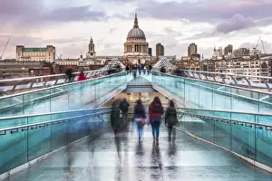 St. Pauls Cathedral at sunset, seen across Millennium Bridge, City of London, London