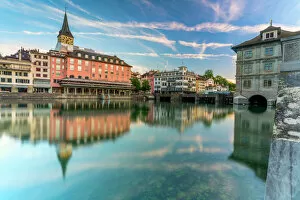 Flowing Water Gallery: St. Peter church and old buildings of Lindenhof mirrored in Limmat River at dawn, Zurich