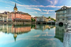 Flowing Water Gallery: St. Peter church and old buildings of Lindenhof mirrored in Limmat River at dawn, Zurich
