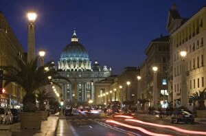 Images Dated 27th October 2009: St. Peters Basilica illuminated at night with moving traffic, Vatican City