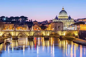 Cupola Prints: St. Peters Basilica and the Vatican with Ponte St Angelo over the River Tiber at dusk