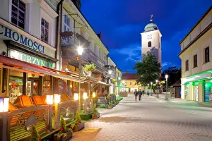 Rzeszow Prints: St. Stanislaw and St. Adalbert Parish Church Clock Tower and street scene at dusk