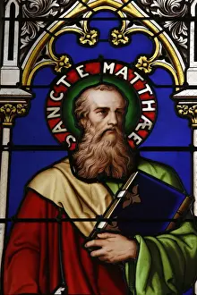 Windows Prints: Stained glass window of St. Matthew at Collegiale Notre-Dame des Marais