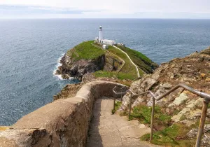 Trail Prints: Stairs leading to South Stack Lighthouse with a view of the sea in Anglesey