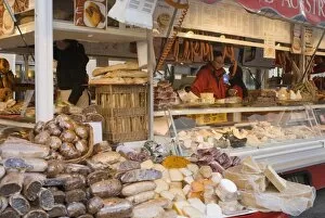 Stall selling cheese, fruit cake and sausages at Christmas Market on Maxheinhardtplatz