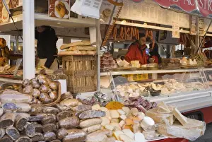 Christmas Markets Prints: Stall selling cheese, fruit cake and sausages at Christmas Market on Maxheinhardtplatz