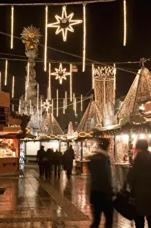 Upper Austria Prints: Stalls of Christmas Market, with Baroque Trinity Column in background, Hauptplatz