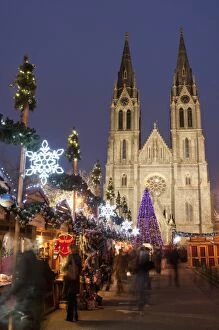 Stalls of the Christmas Market, Christmas tree and Neo-Gothic St. Ludmilla Church