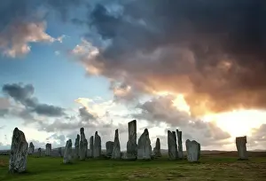 Large Group Of Objects Prints: Standing Stones of Callanish at sunset with dramatic sky in the background