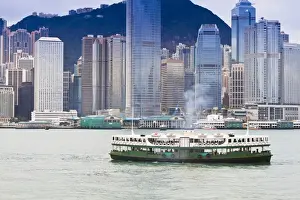 People Travelling Prints: Star ferry crosses Victoria Harbour with Hong Kong Island skyline behind