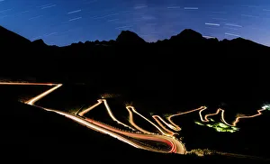 Silhouetted Gallery: Star trail on the lights of car trace at Stelvio Pass, Valtellina, Lombardy, Trentino Alto Adige