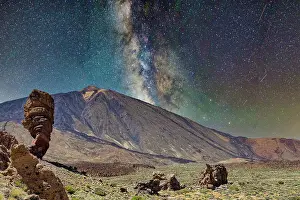 Tenerife Prints: Starry night sky over majestic mountain landscape with Milky Way visible and rocky terrain in the foreground
