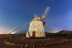 Canary Prints: Starry night sky over a traditional stone mill, Fuerteventura, Canary Islands, Spain
