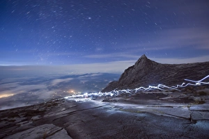 Images Dated 13th October 2009: Stars and torch lights illuminating hiking trail, Kinabalu National Park (4095m)