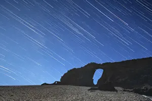 Star Trail Prints: Startrail over the natural stone arch Arco del Jurado at Pena Horadada beach