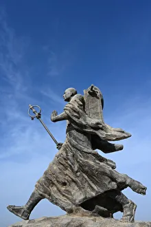Carrying Prints: Statue of 7th century monk, Xuanzang, carrying Buddhist sutras, Gaochang ruins, Xinjiang