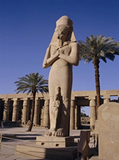 Ramses Ii Prints: Statue of Amun, with Ramses II (Ramasses the Great) between his knees, Karnak