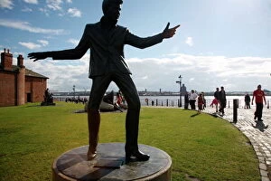 The statue of Billy Fury by Albert Dock and the Mersey River, Liverpool