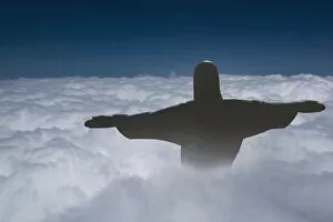 Statue of Christ the Redeemer rising above the clouds, Corcovado, Rio de Janeiro, Brazil, South America