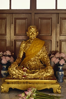 Gold Leaf Prints: Statue covered in gold leaf in Buddhist temple