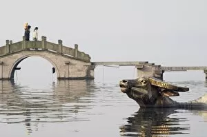 Statue of a golden water buffalo in the waters of West Lake, Hangzhou, Zhejiang Province