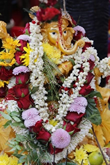 Garlands Prints: Statue of the Hindu God Ganesh with garlands, Paris, France, Europe