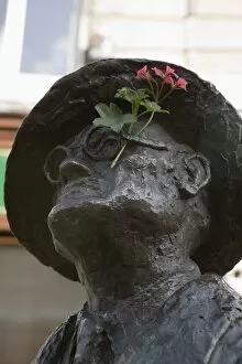 Statue of James Joyce with flower added, North Earl Street, Dublin, Republic of Ireland