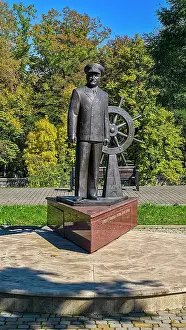 Uniform Prints: Statue of Kapitanu Atomokhoda in a park setting in North Ossetia showcasing maritime history and local culture