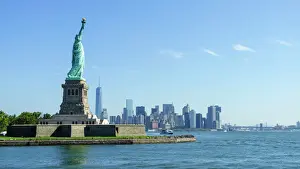 Human Representation Prints: Statue of Liberty and Liberty Island with Manhattan skyline in view