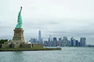 Manhattan Prints: Statue of Liberty with the Lower Manhattan skyline and One World Trade Center beyond