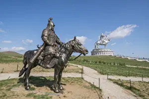 Mongolian Prints: Statue of a Mongolian Empire warrior and Genghis Khan Statue Complex in the background