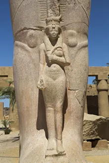 Sculptures Prints: Statue of Nefetari, at base of statue of Ramses II, Great Court, Karnak Temple Complex